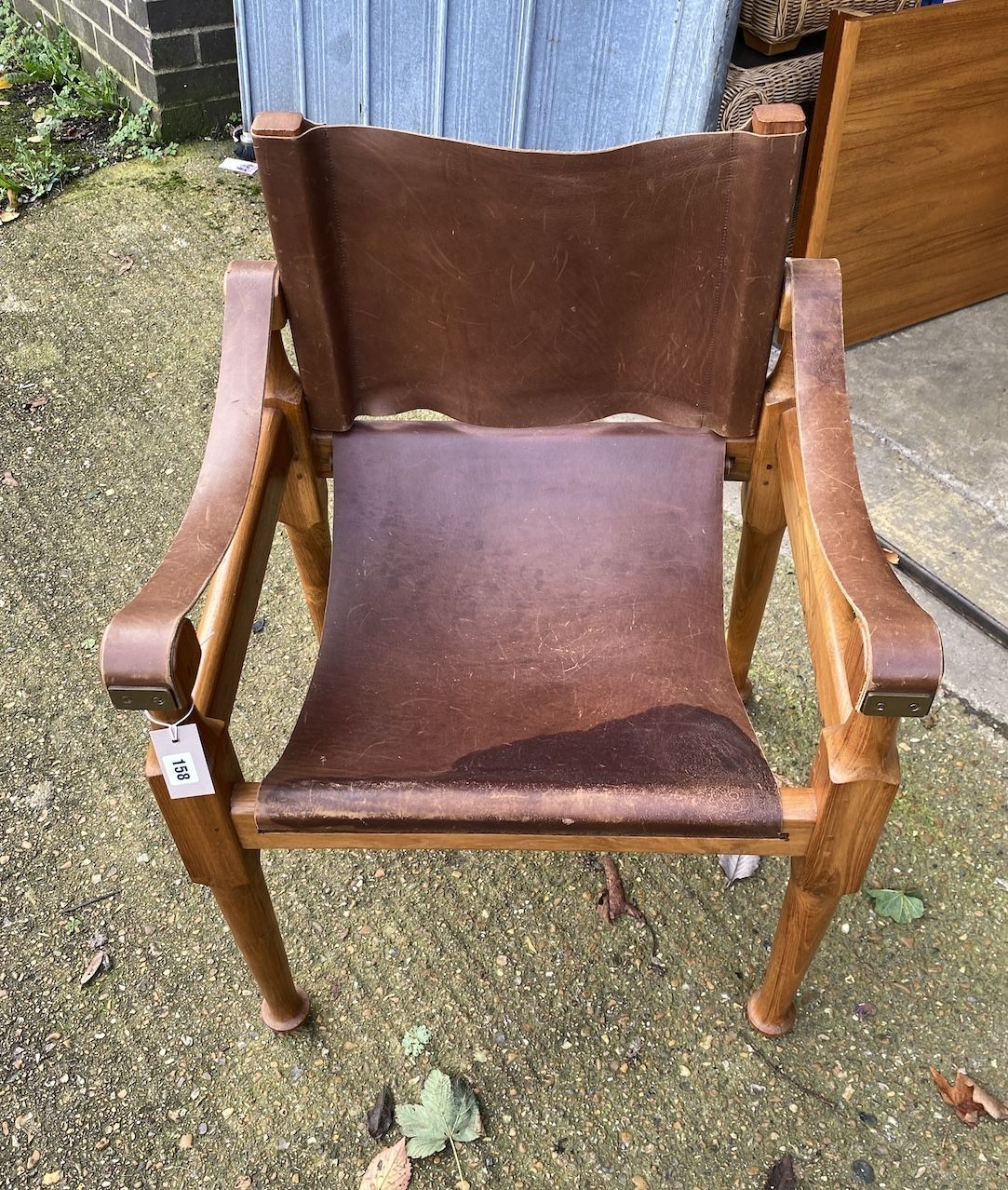 A mid century Italian 'Mufti' Michael D'Souza walnut and tan leather elbow chair, width 60cm, depth 54cm, height 84cm